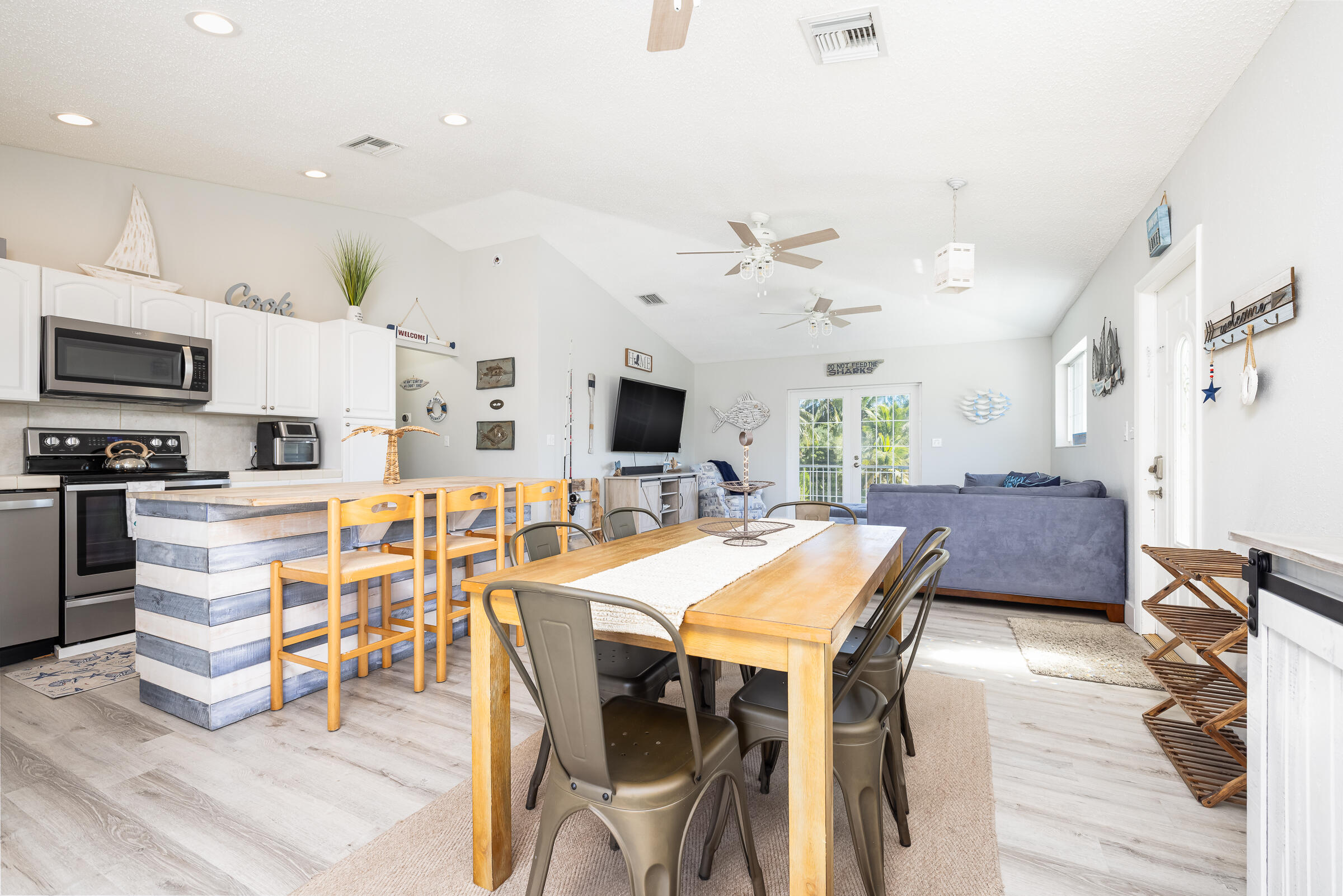 18 Bounty Lane Key Largo, FL 33037 - Photo 11 of 73 a view of a dining room with furniture and a kitchen
