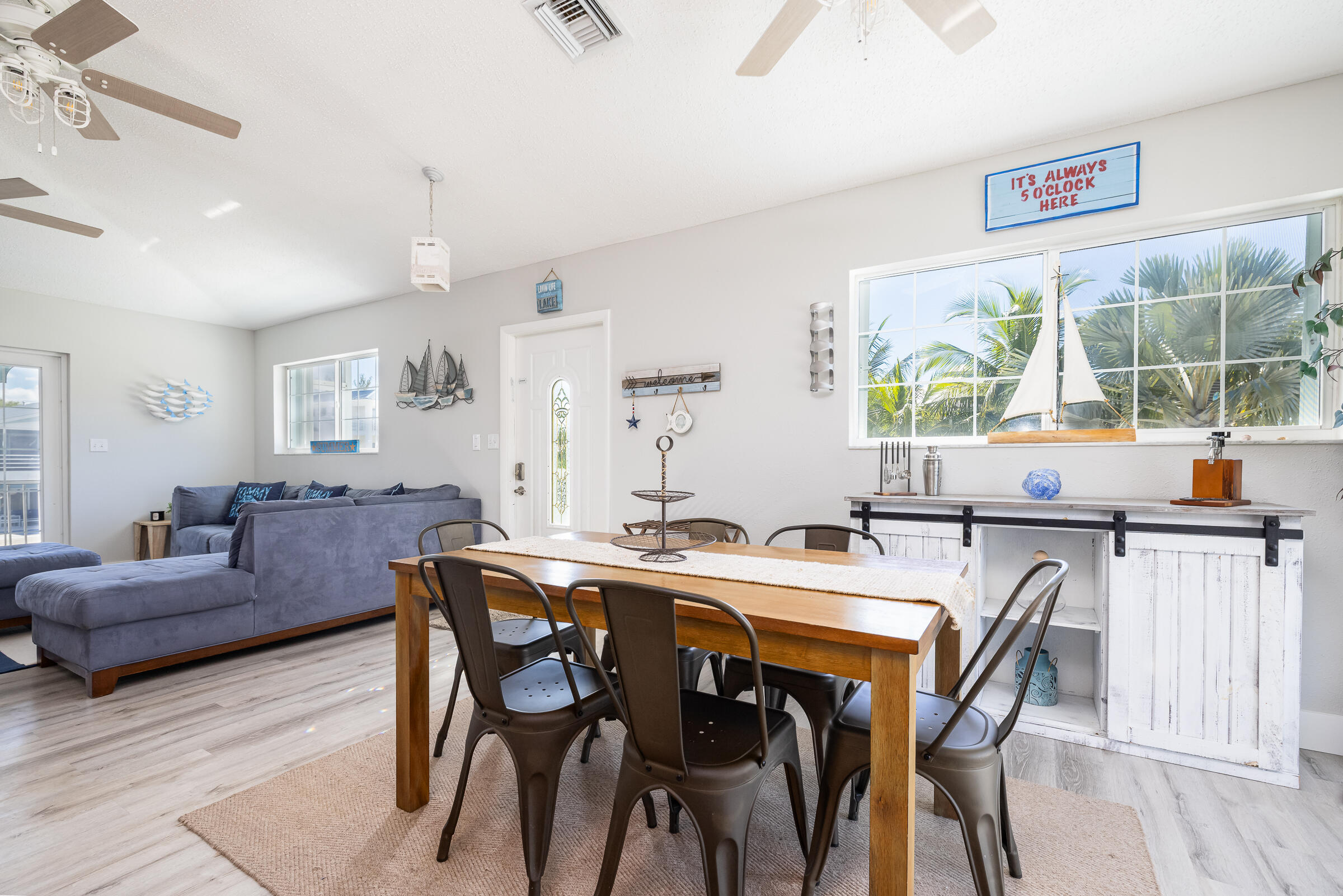 18 Bounty Lane Key Largo, FL 33037 - Photo 12 of 73 a view of a dining room with furniture and a large window