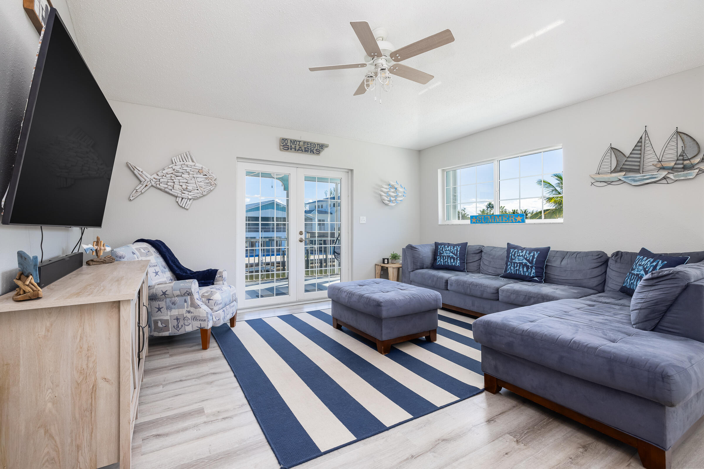 18 Bounty Lane Key Largo, FL 33037 - Photo 15 of 73 a living room with furniture a flat screen tv and a window