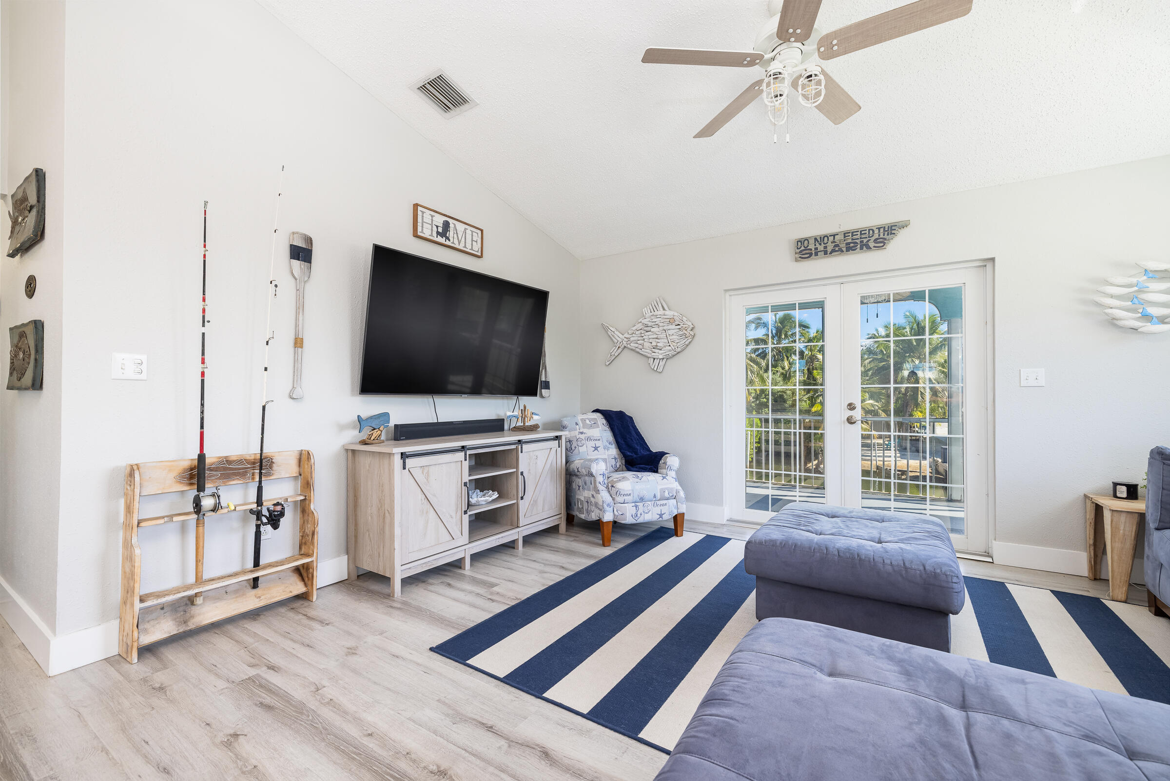 18 Bounty Lane Key Largo, FL 33037 - Photo 16 of 73 a living room with furniture and a flat screen tv