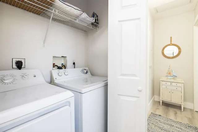 a bedroom with a large bed and a large mirror