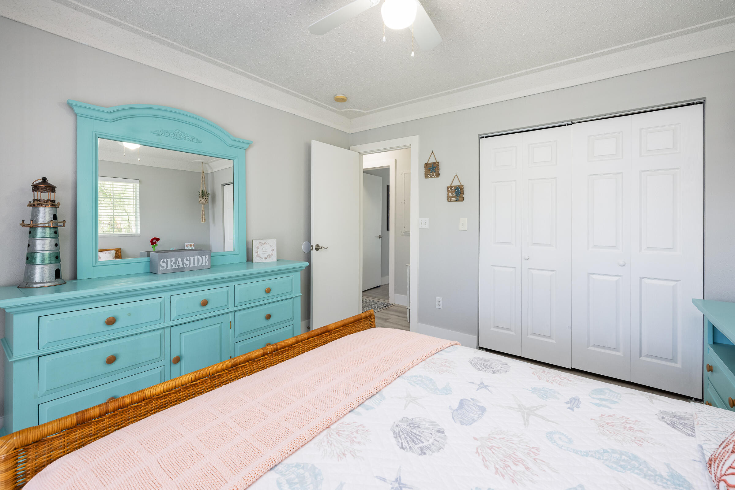 18 Bounty Lane Key Largo, FL 33037 - Photo 27 of 73 a bedroom with a bed and a mirror on dresser