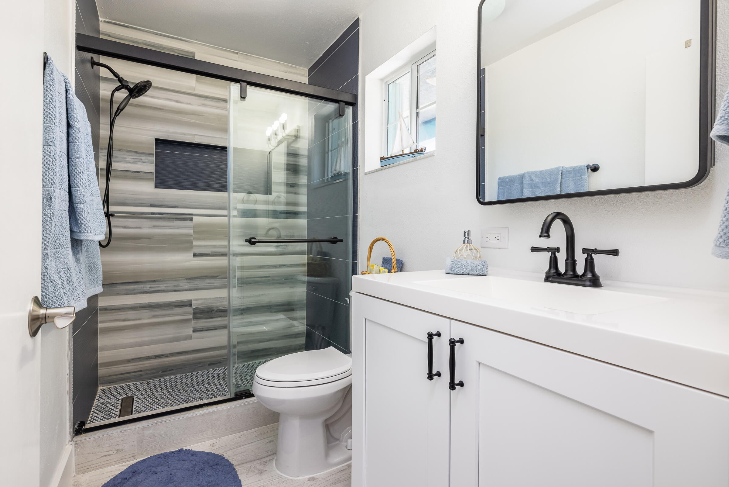 18 Bounty Lane Key Largo, FL 33037 - Photo 32 of 73 a bathroom with a toilet a sink and mirror
