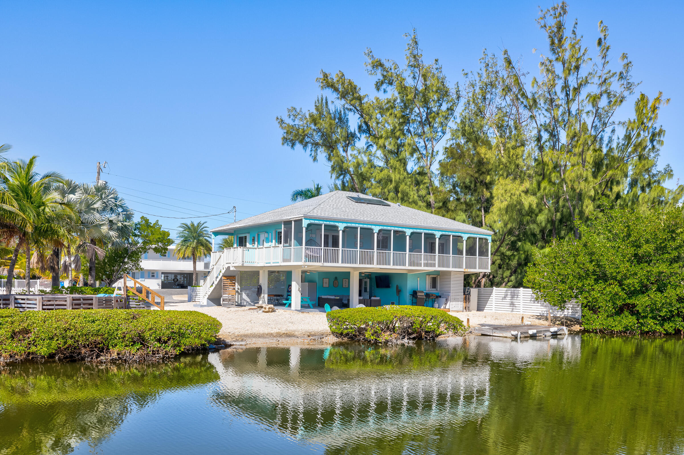 18 Bounty Lane Key Largo, FL 33037 - Photo 45 of 73 a front view of a house with a garden