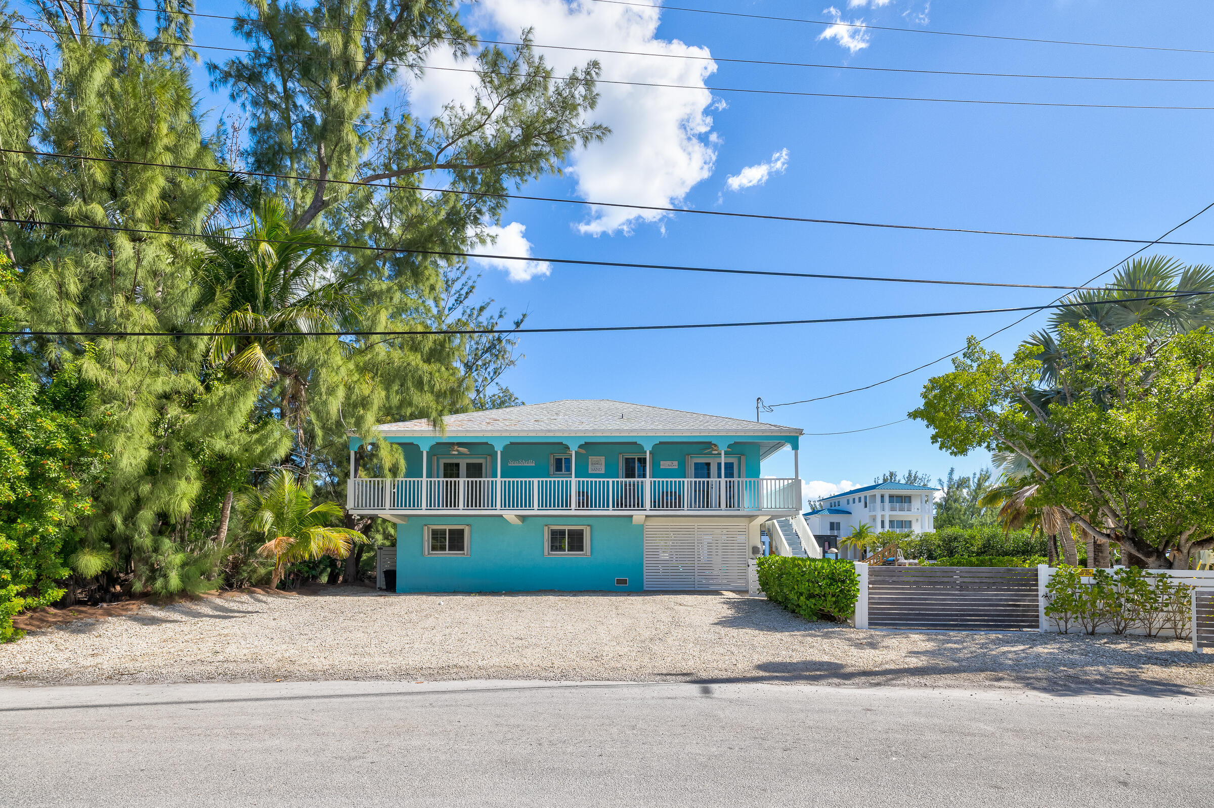 18 Bounty Lane Key Largo, FL 33037 - Photo 5 of 73 a front view of a house with a garden and plants