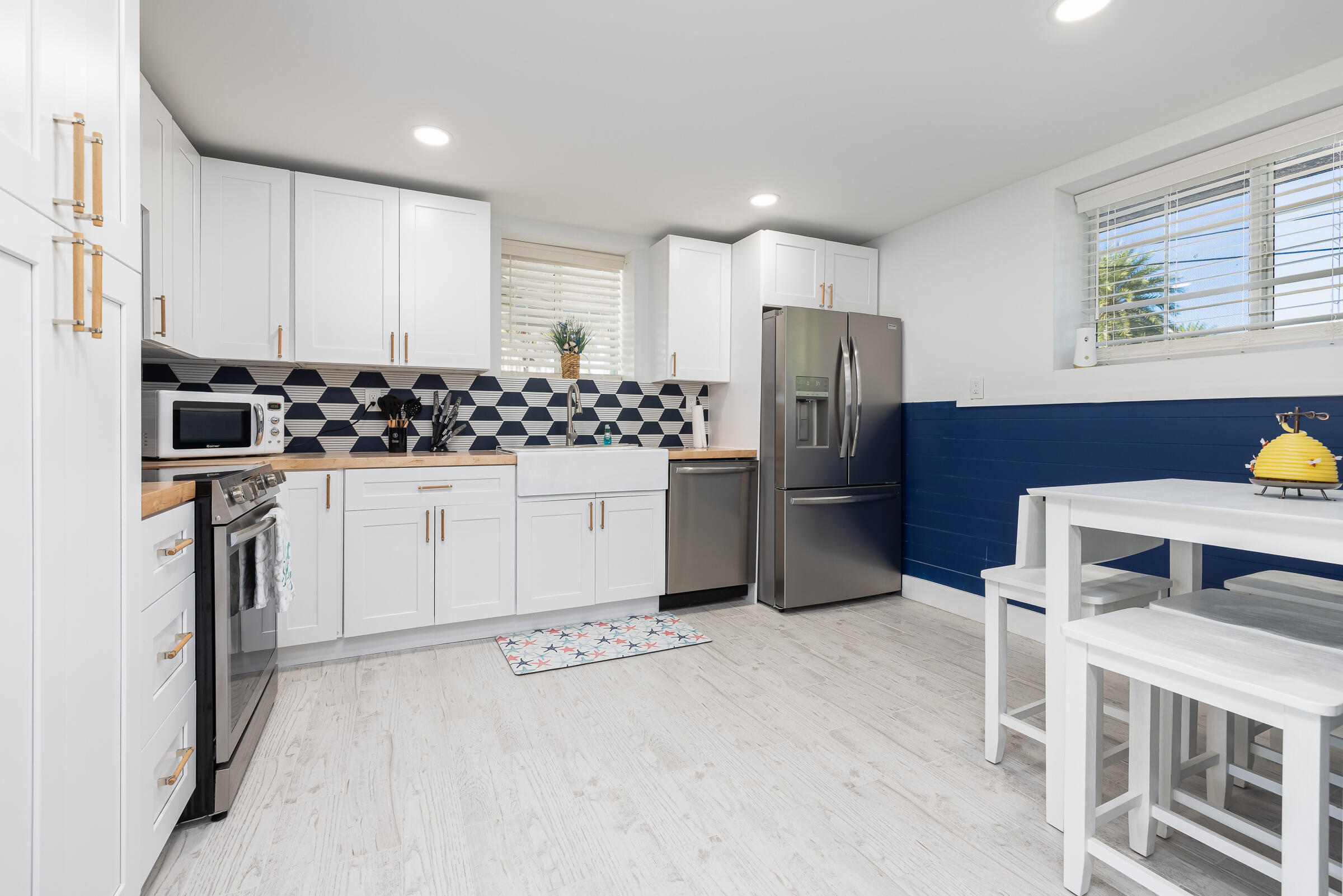 18 Bounty Lane Key Largo, FL 33037 - Photo 57 of 73 a kitchen with stainless steel appliances kitchen island granite countertop a refrigerator and a stove top oven