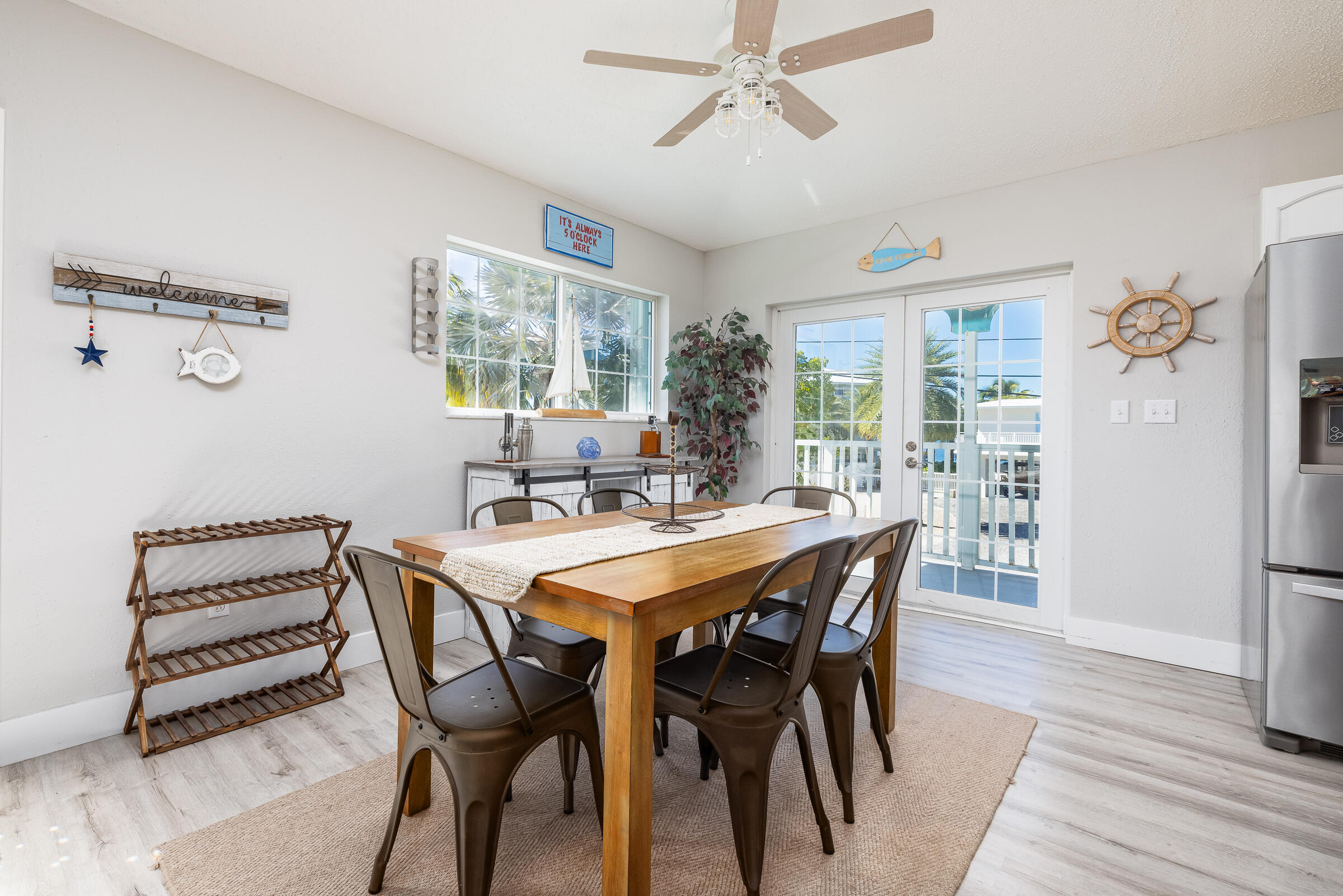 18 Bounty Lane Key Largo, FL 33037 - Photo 10 of 73 a view of a dining room with furniture window and wooden floor