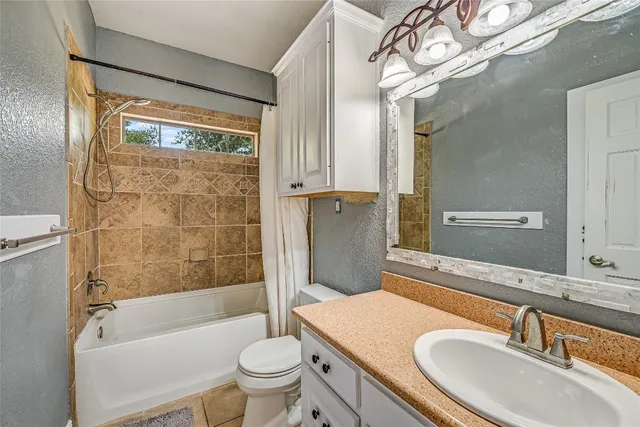 a bathroom with a sink a toilet and a bathtub