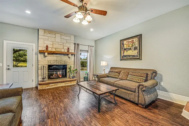 a living room with furniture and a fireplace