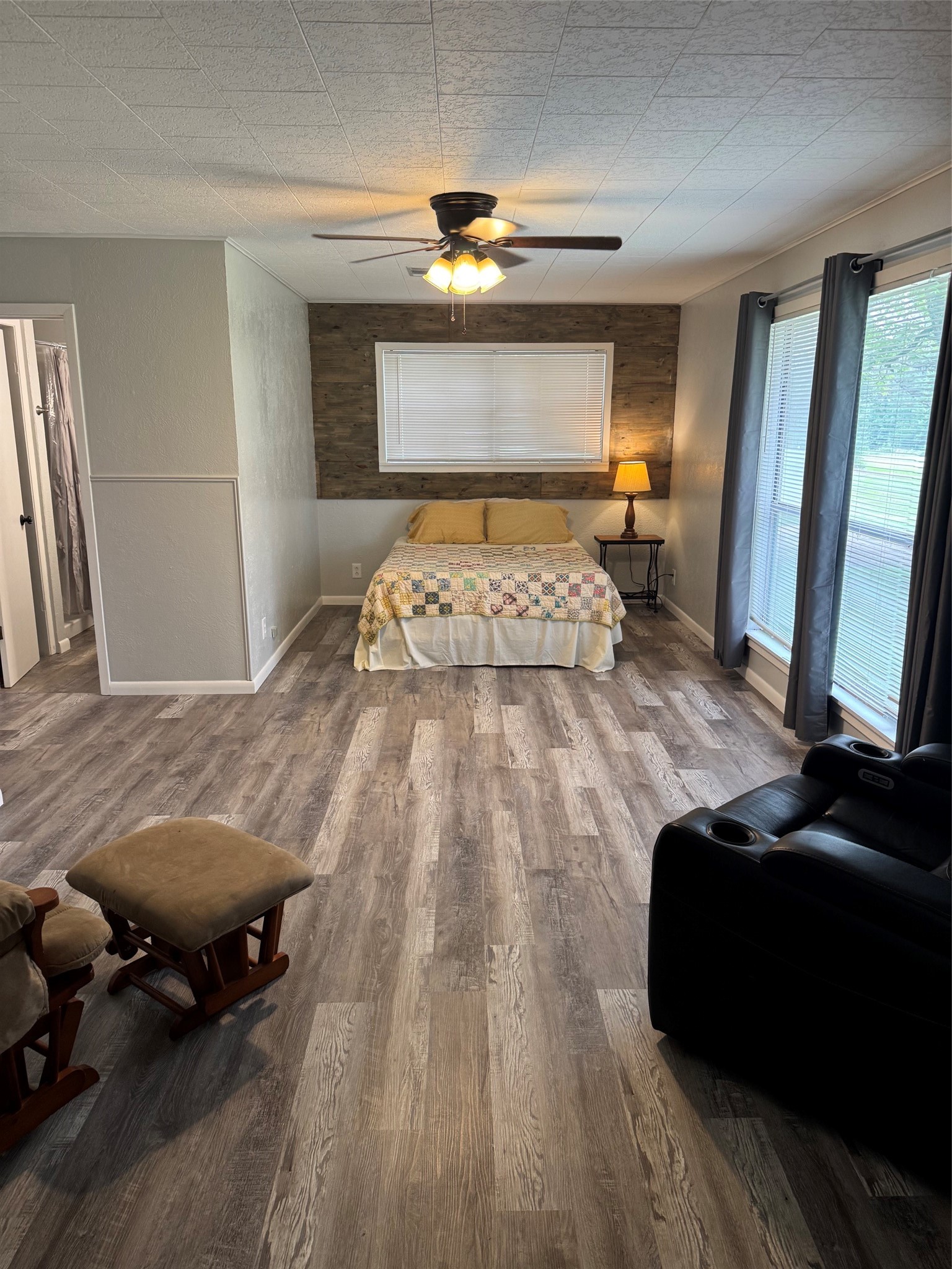 9004 Farm To Market 62 Corrigan, TX 75939 - Photo 17 of 27 a bedroom with a bed and a mirror