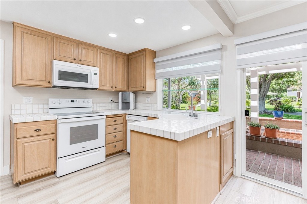 6401 Nohl Ranch Road, Unit 3 Anaheim, CA 92807 - Photo 29 of 48 Kitchen to patio
