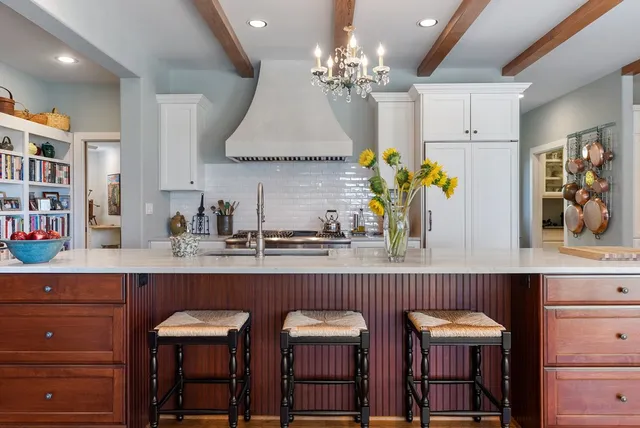 a kitchen with a table and chairs in it