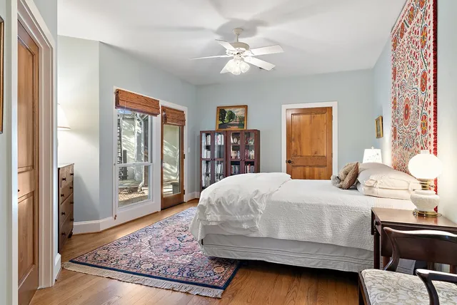 a bedroom with a large bed and a dresser