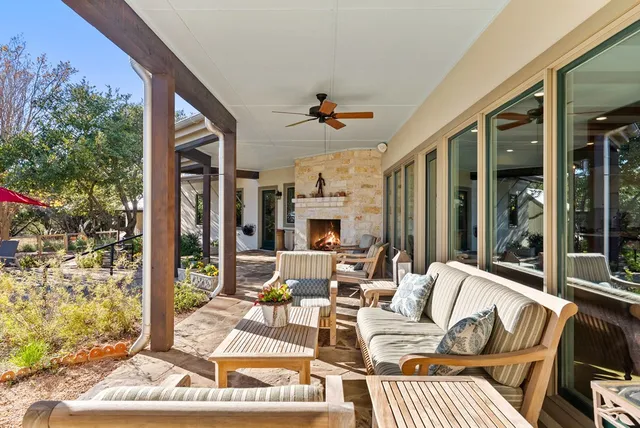 a view of a livingroom with couch and floor to ceiling window