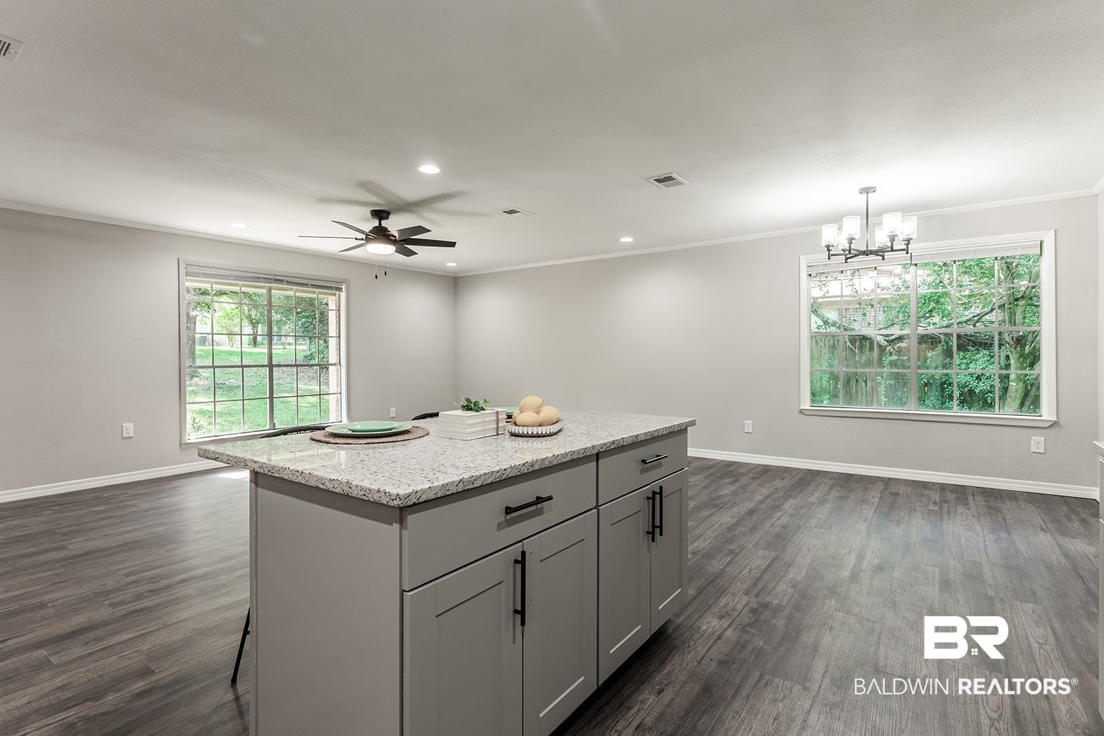 4626 Gold Drive Mobile, AL 36619 - Photo 9 of 48 Kitchen with plenty of natural light, a center island, dark hardwood / wood-style floors, and ceiling fan with notable chandelier