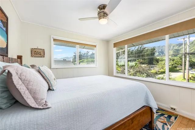 a bedroom with a bed and window