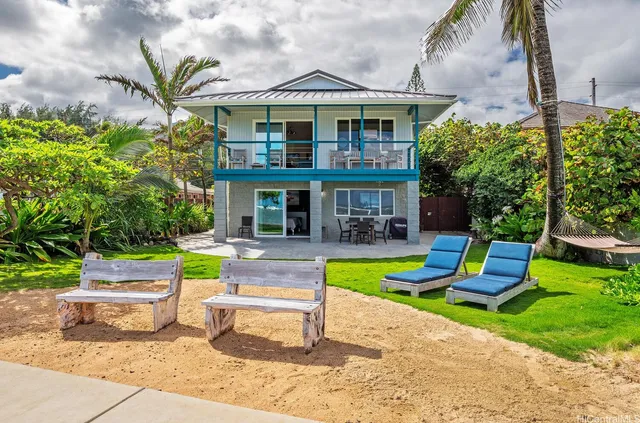 a view of a house with a yard porch and sitting area