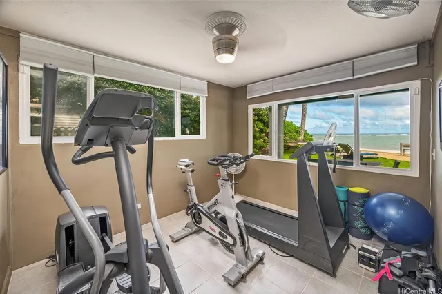 a room with gym equipment and a large window