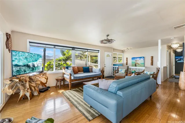 a living room with furniture and a large window