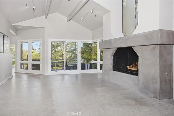 a living room with furniture and windows