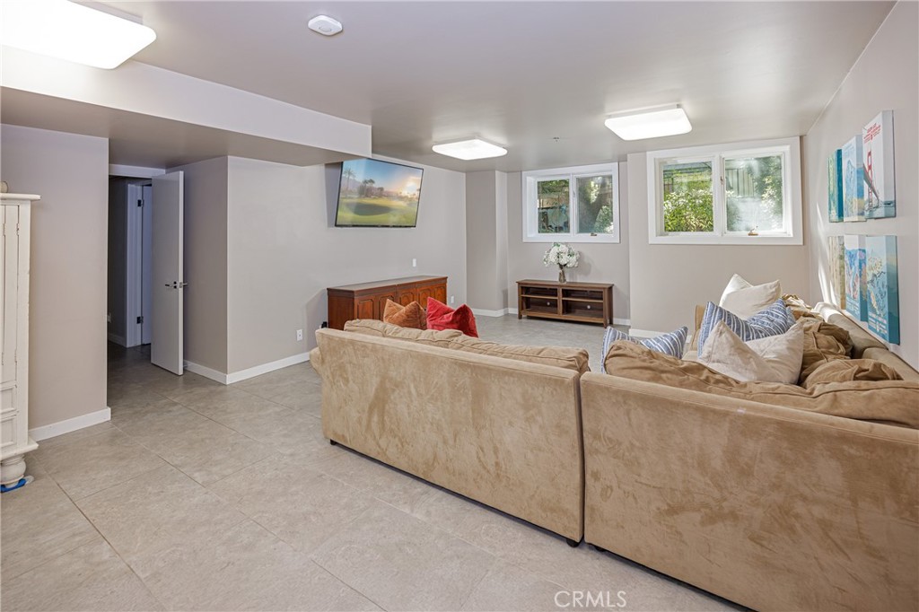 31561 Peppertree-Bend San Juan Capistrano, CA 92675 - Photo 15 of 58 a living room with furniture and a flat screen tv