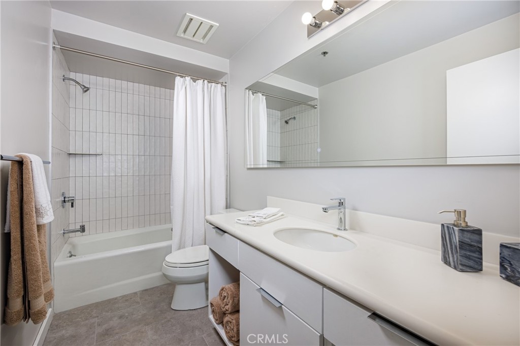 31561 Peppertree-Bend San Juan Capistrano, CA 92675 - Photo 21 of 58 a bathroom with a sink a toilet and shower