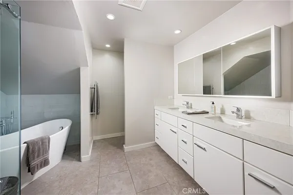 a utility room with cabinets dryer and washer