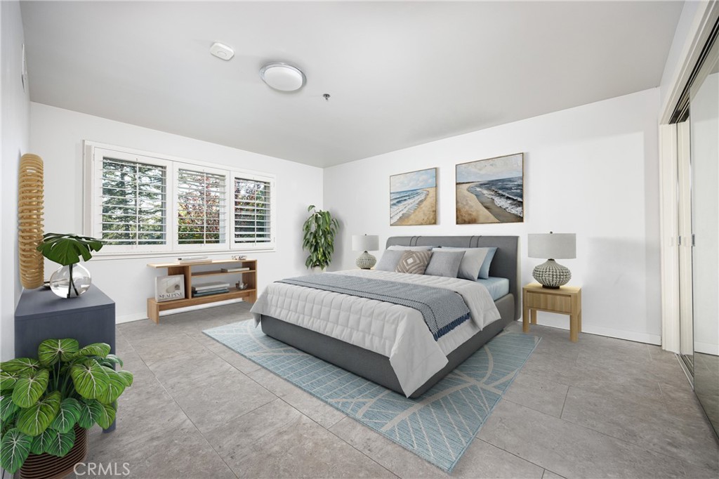 31561 Peppertree-Bend San Juan Capistrano, CA 92675 - Photo 24 of 58 a spacious bedroom with a bed and a couch