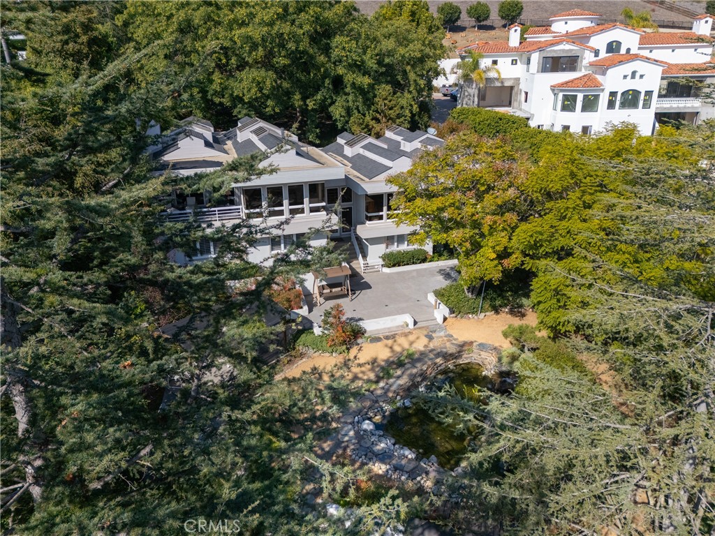 31561 Peppertree-Bend San Juan Capistrano, CA 92675 - Photo 31 of 58 a aerial view of a house with a yard and fountain