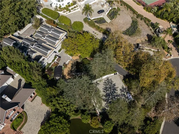 a front view of a building with a garden