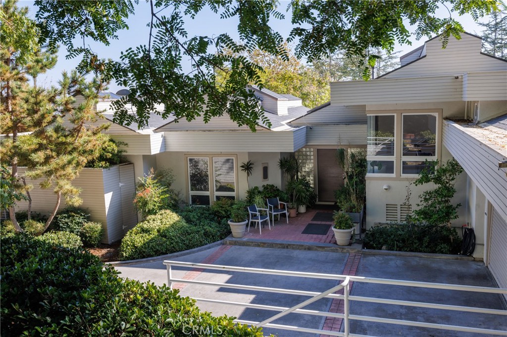 31561 Peppertree-Bend San Juan Capistrano, CA 92675 - Photo 4 of 58 a view of a chair and tables in the patio of the house