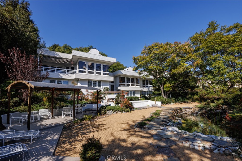 31561 Peppertree-Bend San Juan Capistrano, CA 92675 - Photo 42 of 58 a front view of a building with a garden