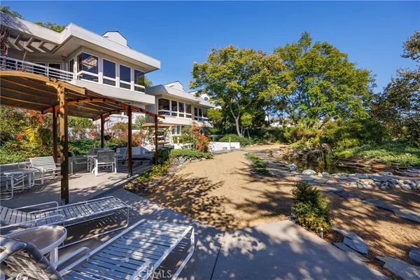 an aerial view of residential house with outdoor space
