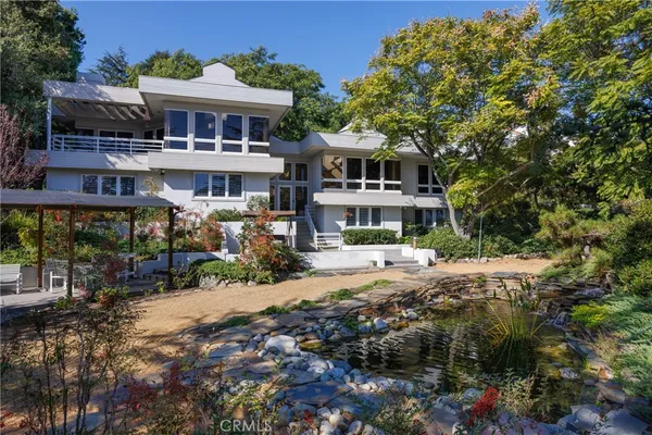 a front view of a house with swimming pool