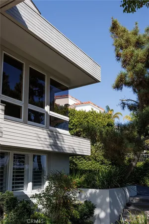 a view of house with swimming pool