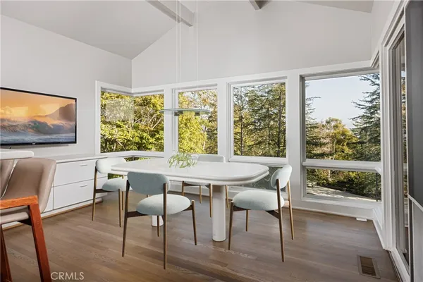a view of a dining room with furniture window and outside view
