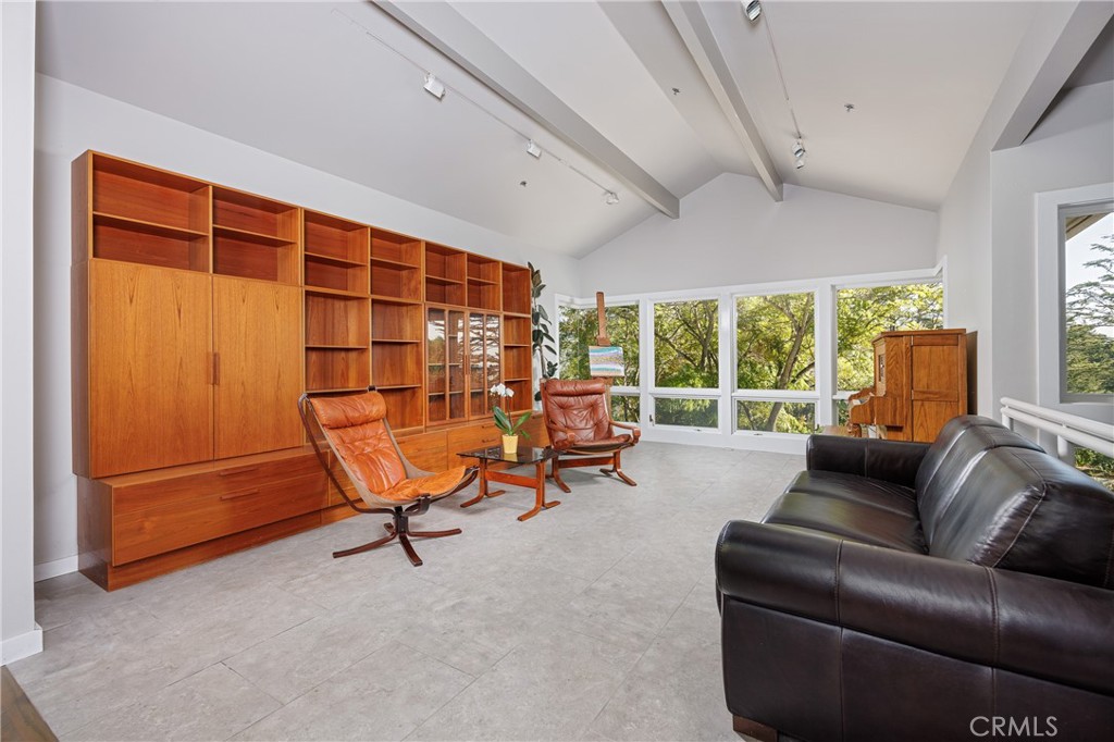 31561 Peppertree-Bend San Juan Capistrano, CA 92675 - Photo 9 of 58 a living room with furniture and a floor to ceiling window