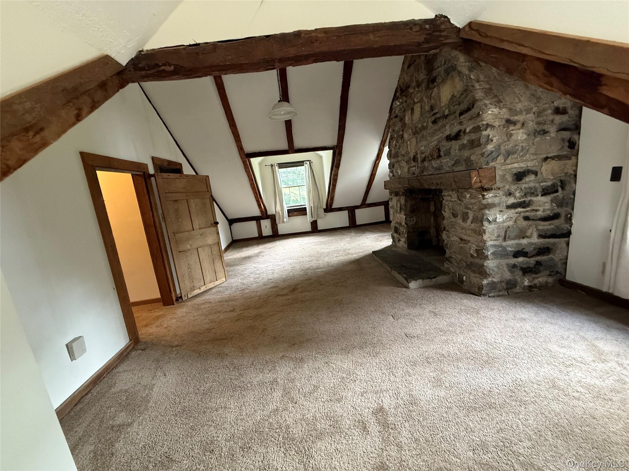 241 White Bridge Road Middletown, NY 10940 - Photo 22 of 29 Unfurnished living room with carpet and a stone fireplace