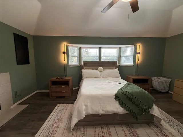 a bedroom with bed and window