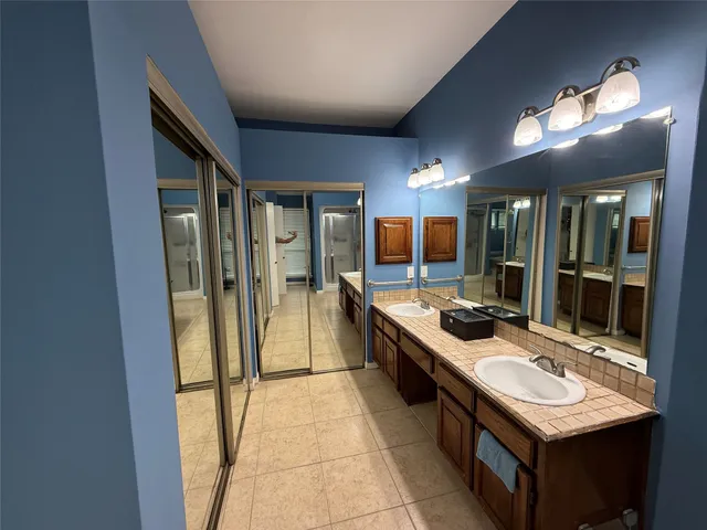 a kitchen with kitchen island a sink stove and refrigerator
