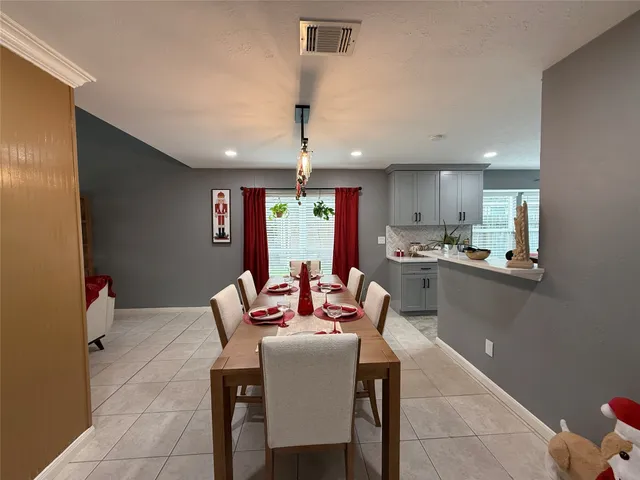 a living room with stainless steel appliances kitchen island granite countertop furniture and a kitchen view