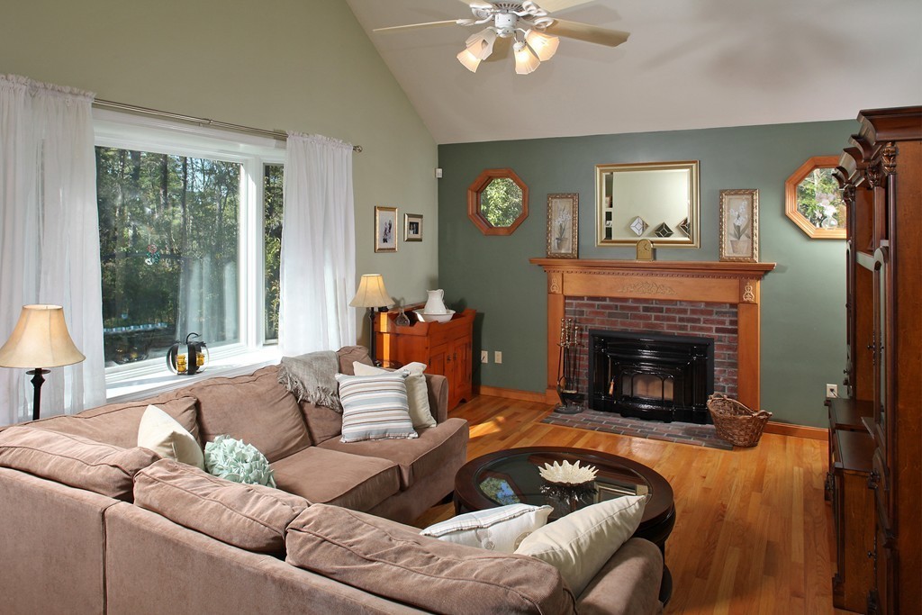 48 Roxy Cahoon Road Plymouth, MA 02360 - Photo 3 of 14 a living room with furniture and a fireplace