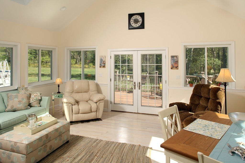48 Roxy Cahoon Road Plymouth, MA 02360 - Photo 5 of 14 a living room with furniture and floor to ceiling windows