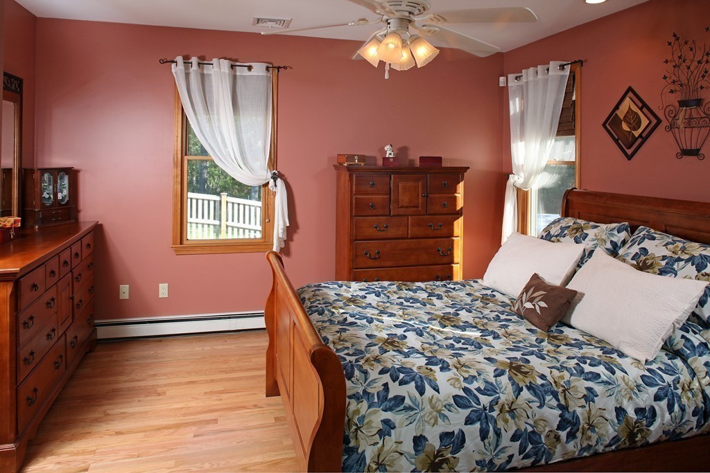 48 Roxy Cahoon Road Plymouth, MA 02360 - Photo 8 of 14 a bedroom with a bed and a dresser
