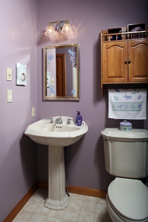 48 Roxy Cahoon Road Plymouth, MA 02360 - Photo 10 of 14 a bathroom with a toilet sink and mirror