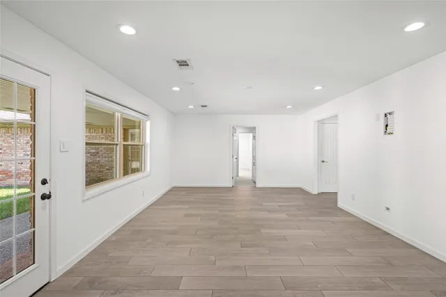 a view of an empty room with a window