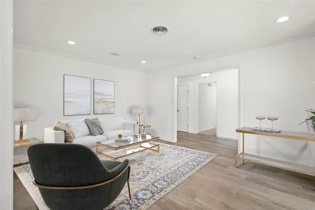 a living room with furniture and a rug