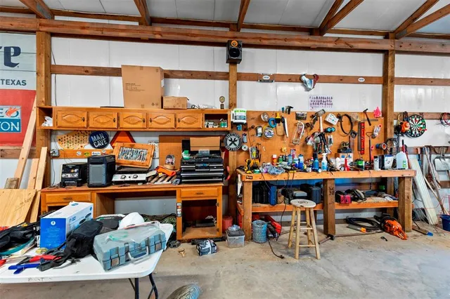 a view of a garage with a lot of stuff