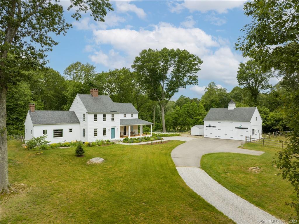 144 Neck Road Old Lyme, CT 06371 - Photo 1 of 1 an aerial view of a house with swimming pool garden and trees