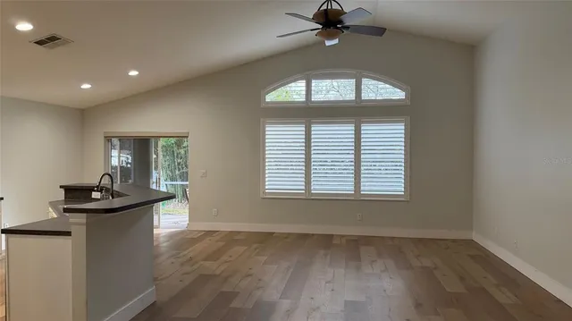a view of an empty room with a window